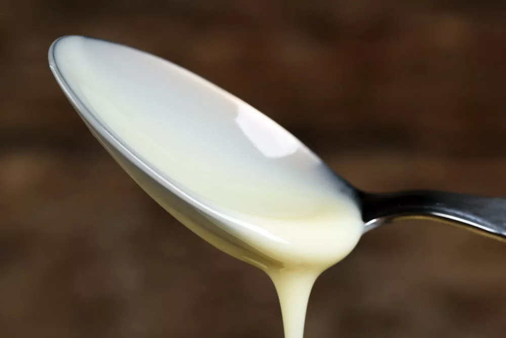 condensed milk in a spoon